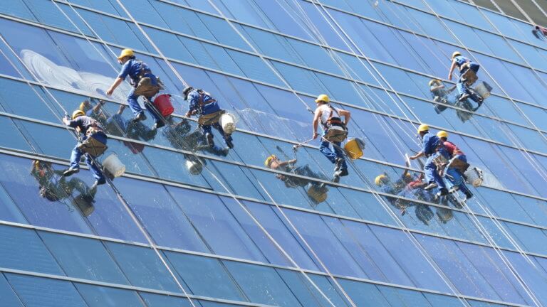 Photo of window cleaners working on a skyscraper